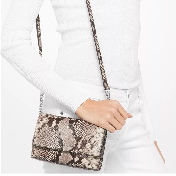 Michael Kors Handbags - Michael Kors Ruby MD Clutch Embossed Leather